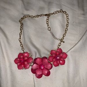 pink flower necklace.